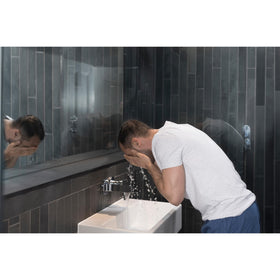 DOVE MEN + CARE Hydrate Plus Face Wash 5 oz in bathroom setting