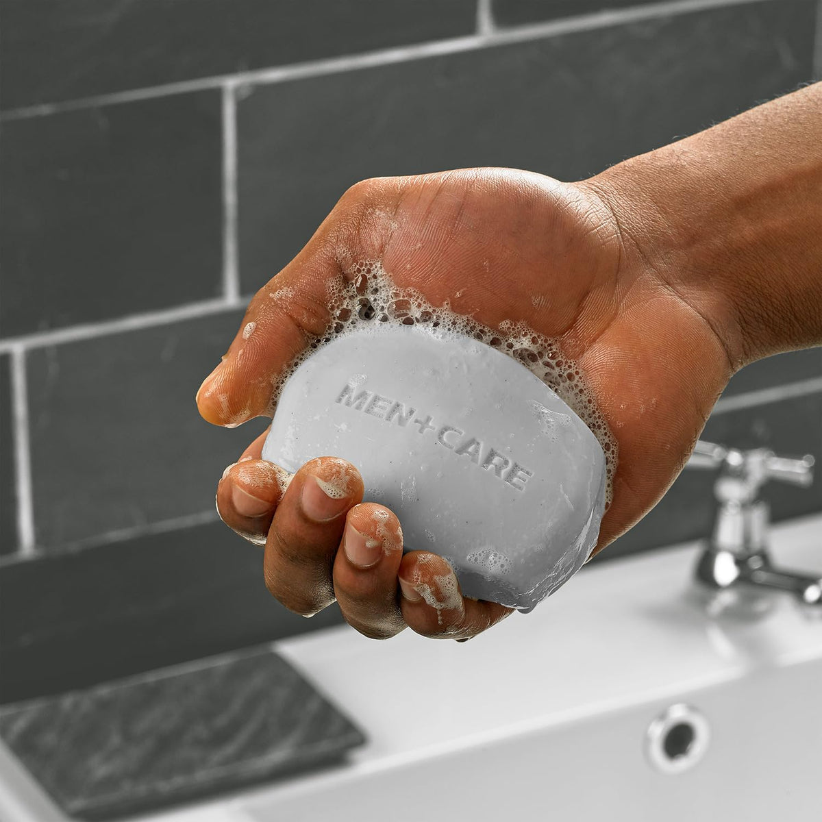 Dove Men+Care soap bars in a bathroom setting