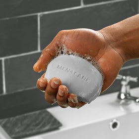 Dove Men+Care soap bars in a bathroom setting