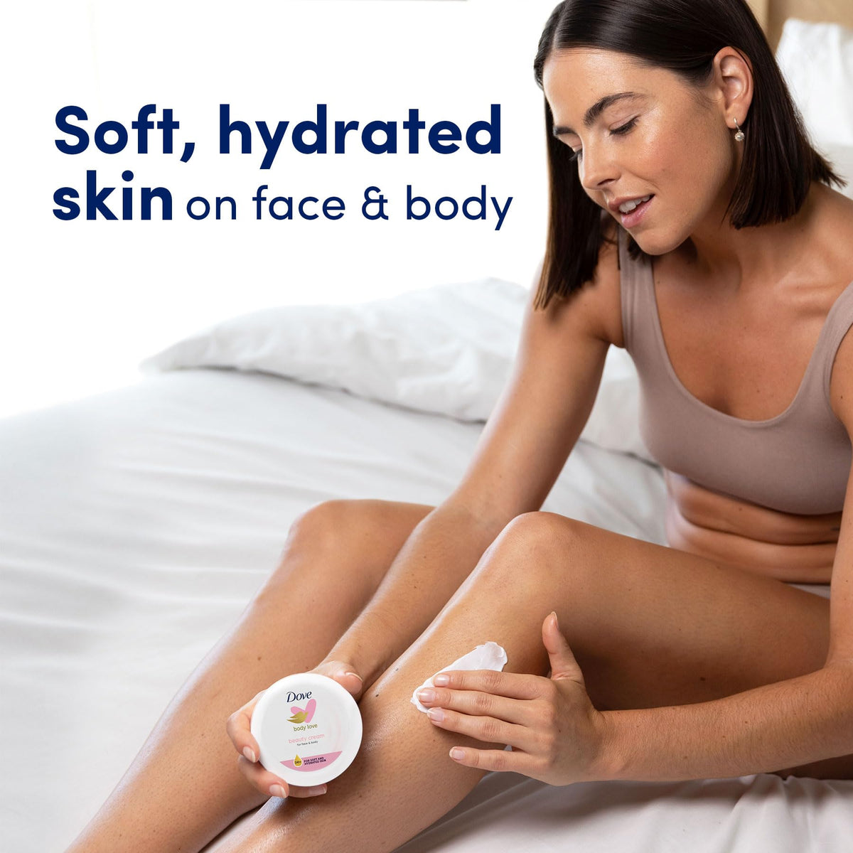 Dove Nourishing Body Care Beauty Cream with a towel and skincare items