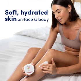 Dove Nourishing Body Care Beauty Cream with a towel and skincare items