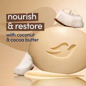 Dove Restoring Beauty Bar Soap Coconut & Cocoa Butter on a soap dish