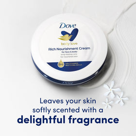 Dove Rich Nourishing Cream jars on a bathroom counter