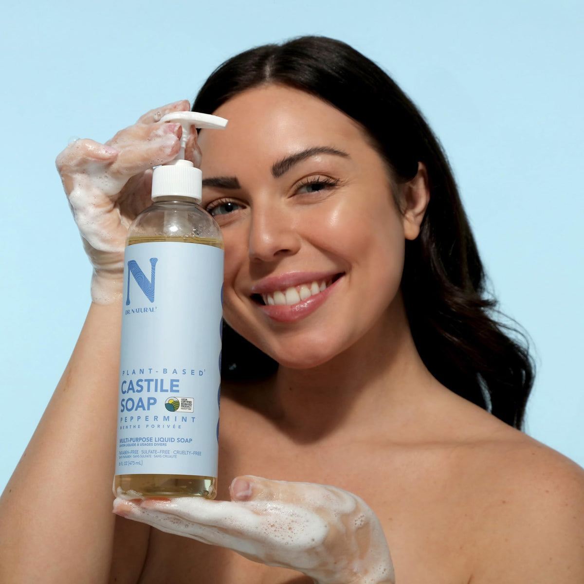 Dr. Natural Castile Liquid Soap 16 oz peppermint in a bathroom setting