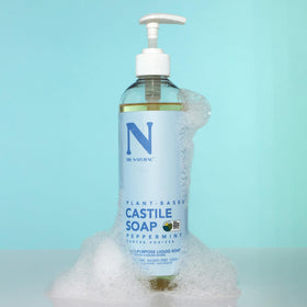 Dr. Natural Castile Liquid Soap 16 oz peppermint pouring into hands