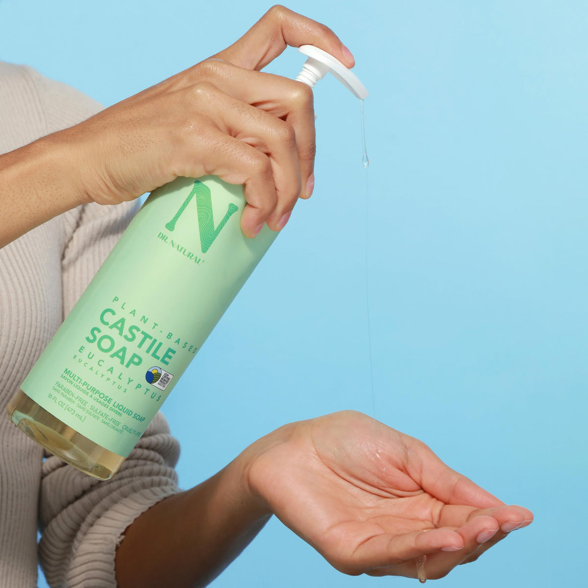 Dr. Natural Castile Liquid Soap in a shower caddy