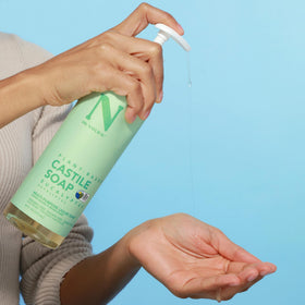 Dr. Natural Castile Liquid Soap in a shower caddy