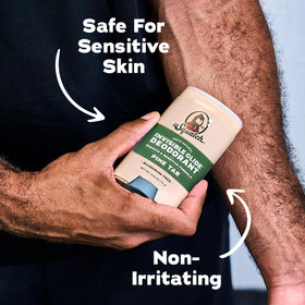 Dr. Squatch deodorant with fresh pine and birchwood background
