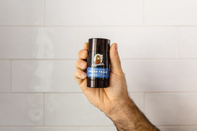 Dr. Squatch Natural Deodorant Fresh Falls lifestyle shot outdoors