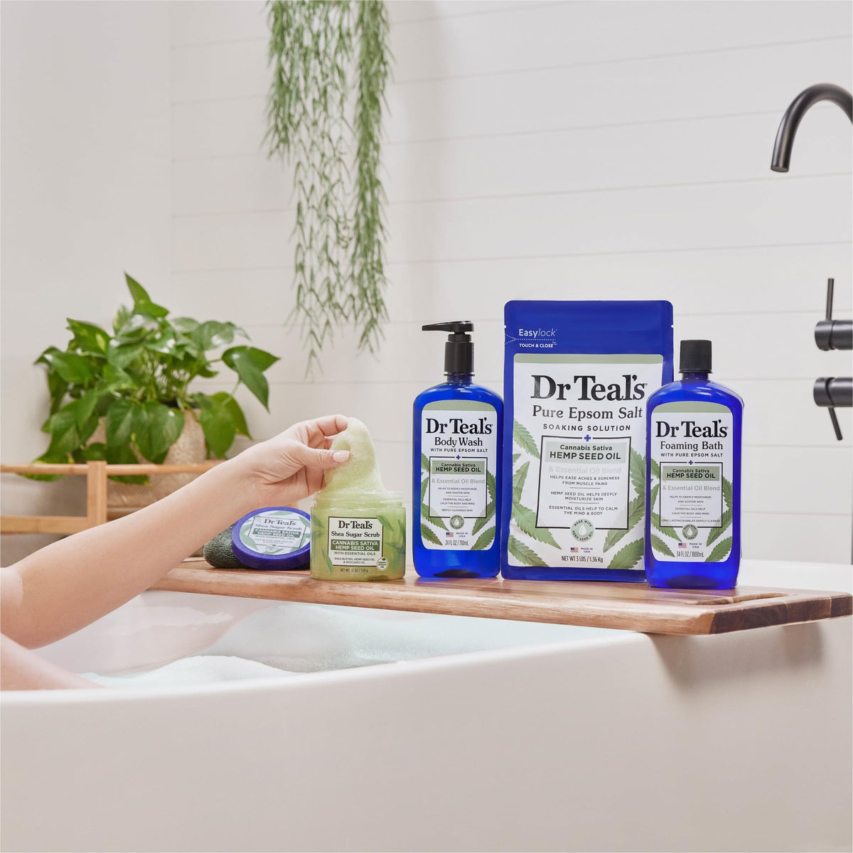 Dr Teal's Body Wash pouring into a shower sponge
