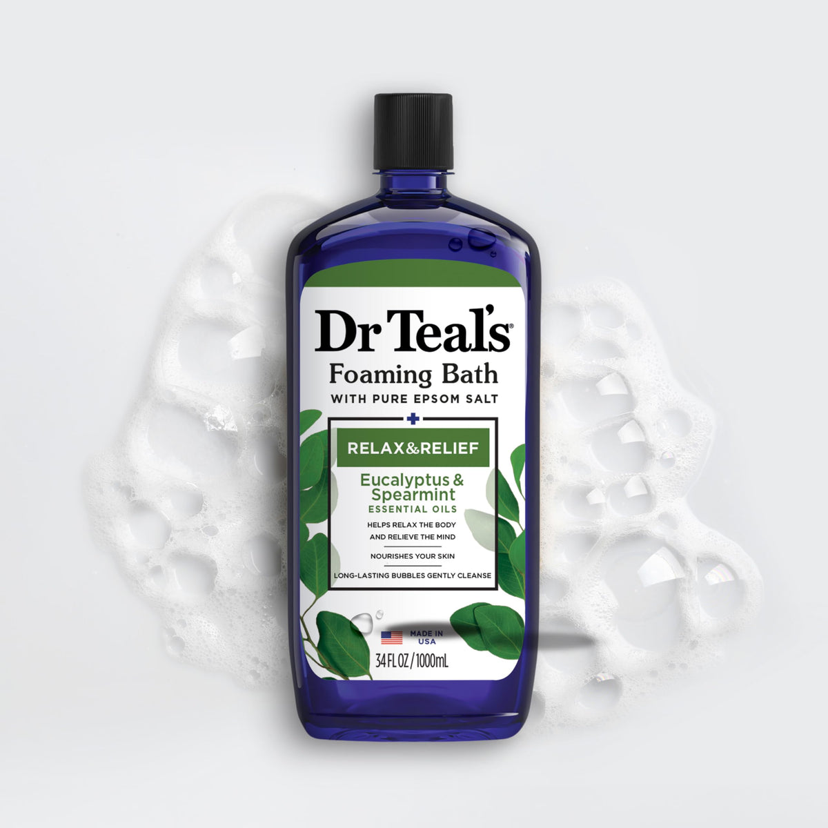 Dr Teal's Eucalyptus & Spearmint Foaming Bath with a bath towel and candles