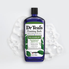 Dr Teal's Eucalyptus & Spearmint Foaming Bath with a bath towel and candles