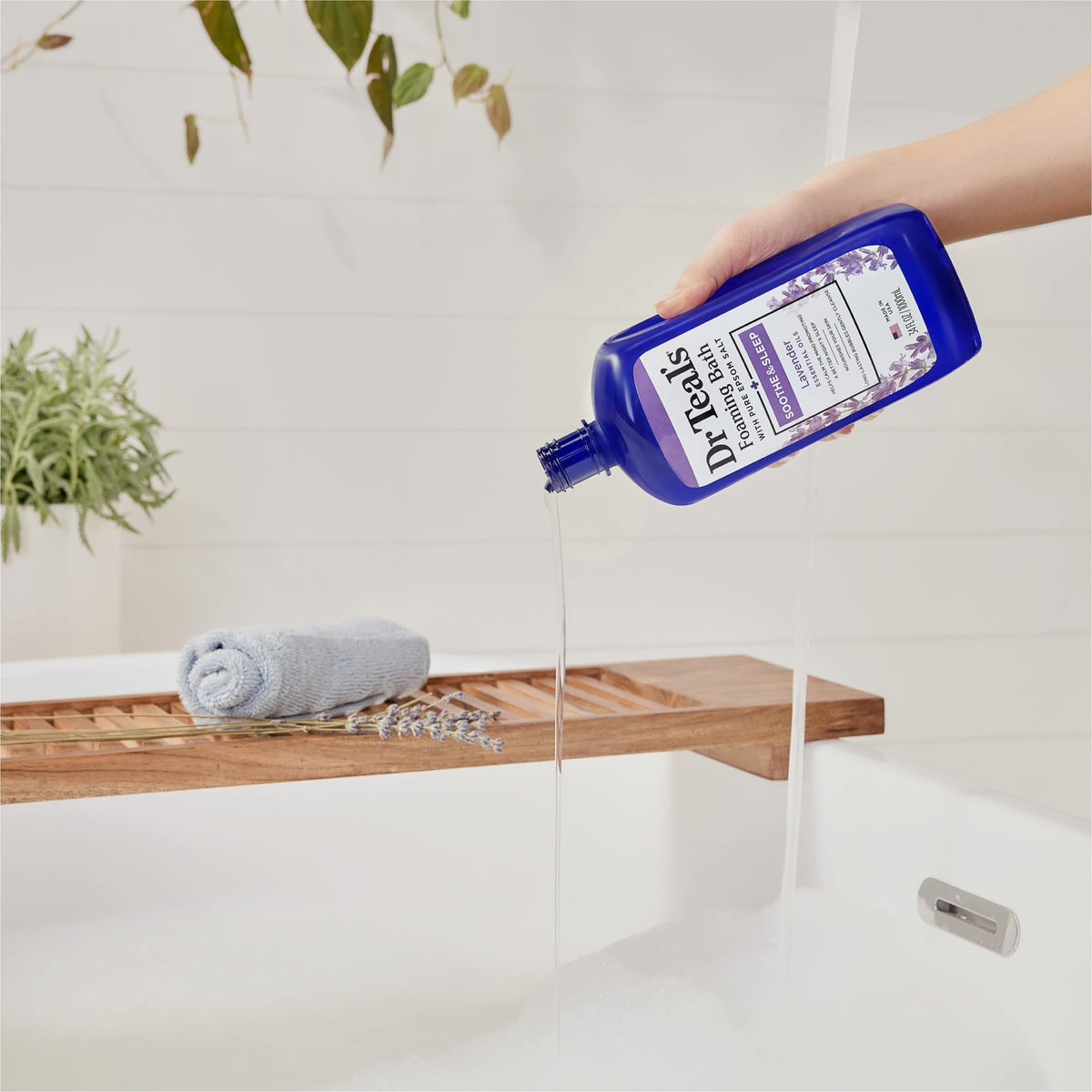 Dr Teal's Foaming Bath Lavender pouring into a tub