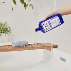 Dr Teal's Foaming Bath Lavender pouring into a tub