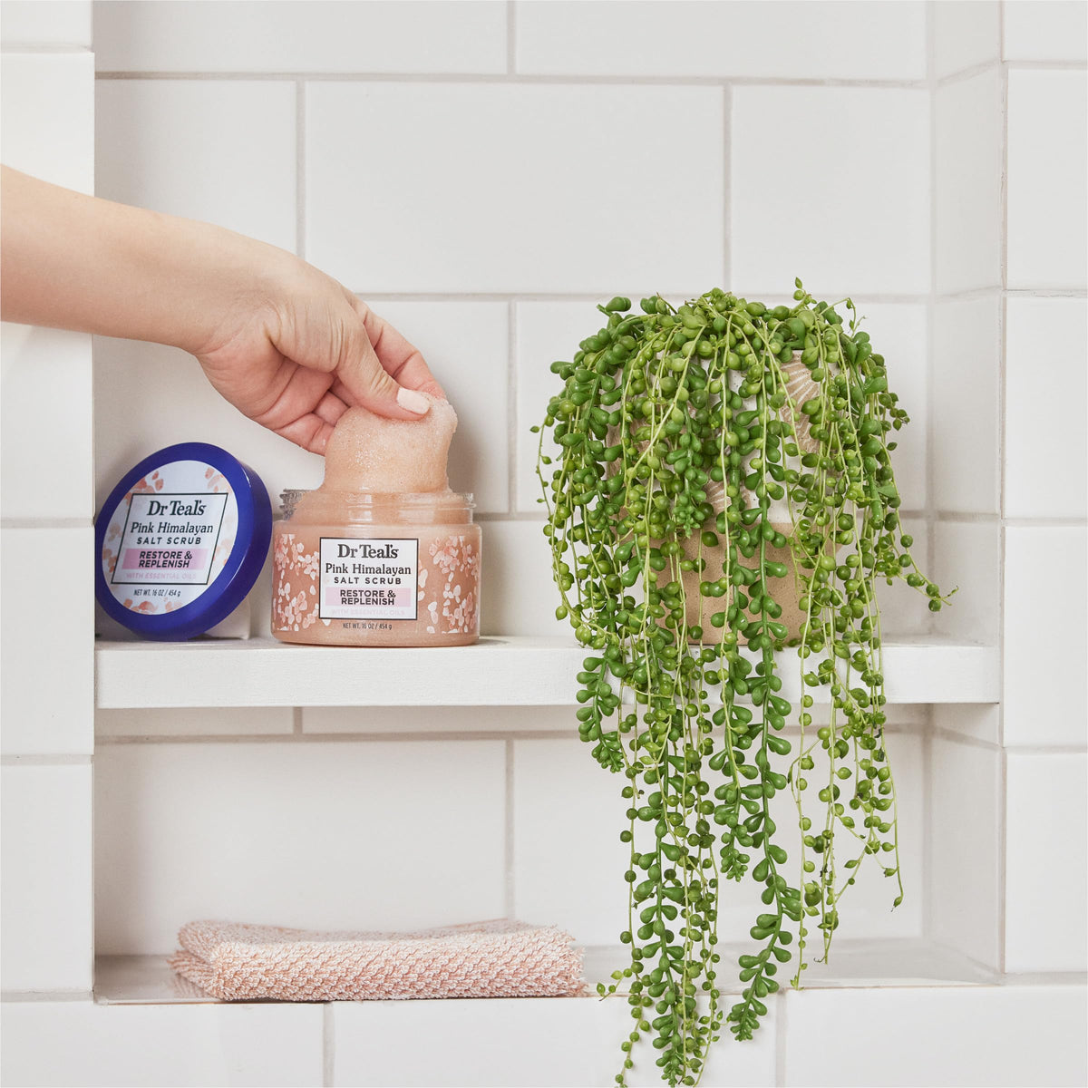 Dr Teal's Pink Himalayan Salt Body Scrub in a bath setting