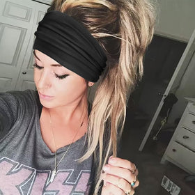 DRESHOW Wide Headband in vibrant colour on a model