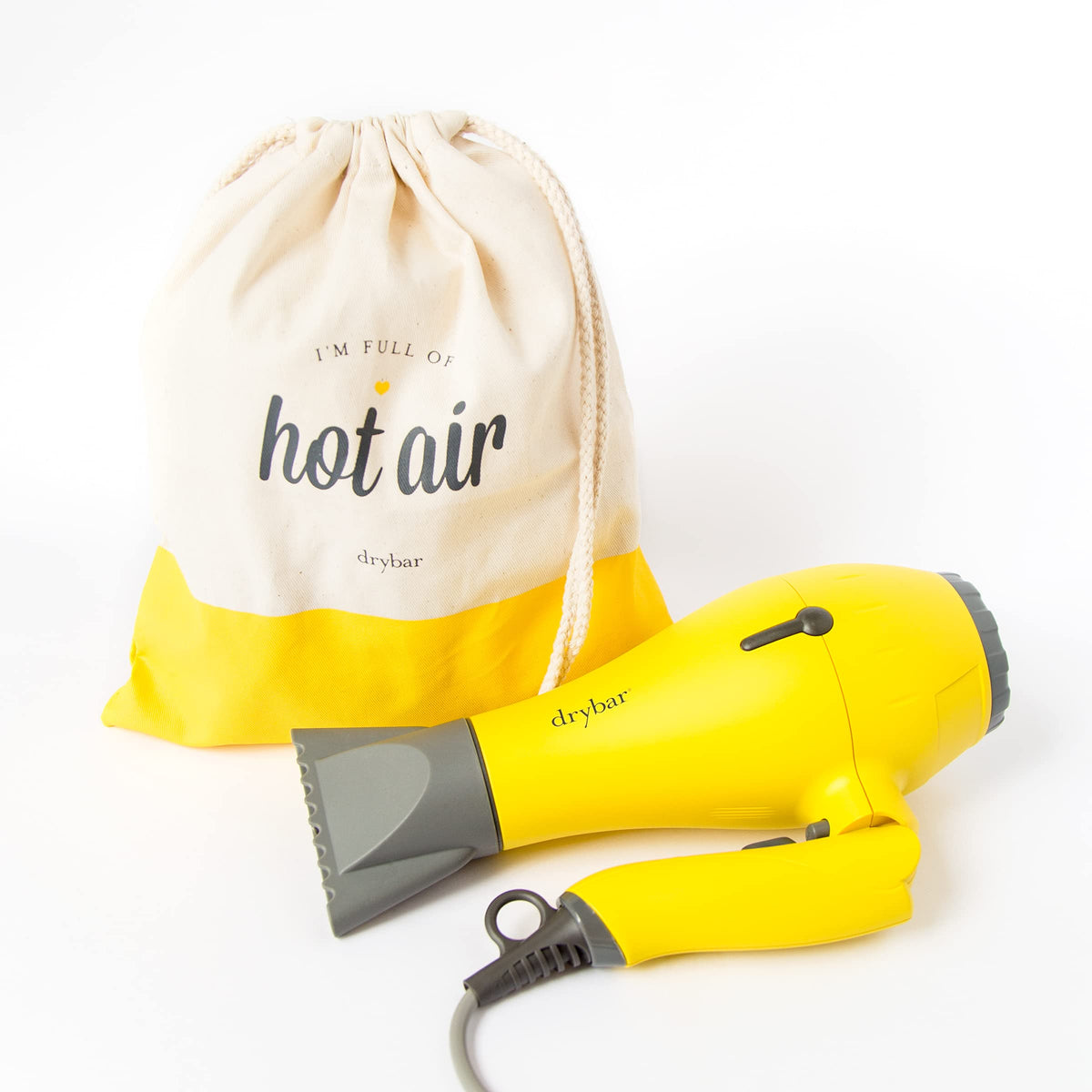 Drybar Baby Buttercup Travel Blow-Dryer in logo travel bag