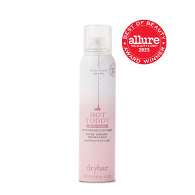 Drybar Hot Toddy Heat Protectant Mist on a bathroom counter
