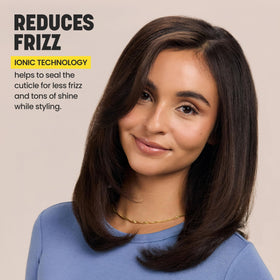 Drybar The Single Shot Blow-Dryer Brush on a vanity with hair products