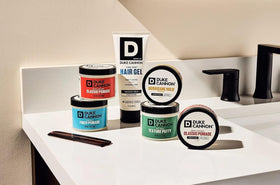 Duke Cannon Dry Hold Texture Putty 2 oz on a grooming table