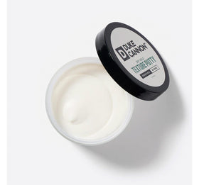 Duke Cannon Dry Hold Texture Putty with a scoop showing texture