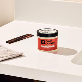 Duke Cannon News Anchor Classic Pomade applied to hair