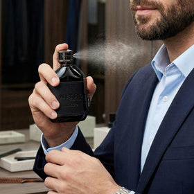 Dumont Nitro Intense bottle on a stylish surface