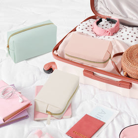 Dunzy makeup bags in different colours on a table