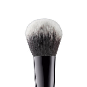e.l.f. Flawless Face Brush side view showing ergonomic grip