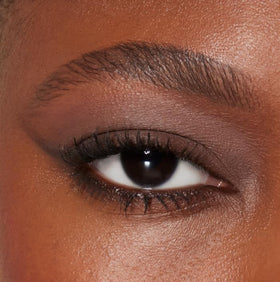 e.l.f. Perfect 10 Eyeshadow Palette in lifestyle setting with makeup brushes