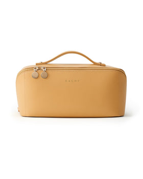 EACHY Travel Makeup Bag yellow on a bathroom counter