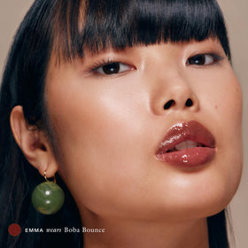 EADEM Tinted Lip Balm Boba Bounce on a vanity
