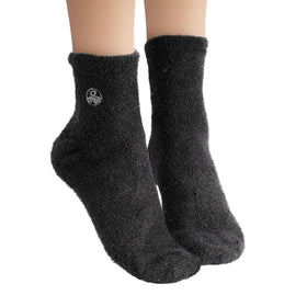 Earth Therapeutics Aloe Socks in a laundry basket