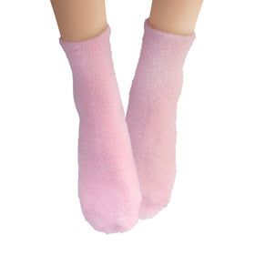 Earth Therapeutics Aloe Vera Socks inside a laundry basket