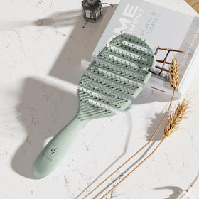 ecoed Detangler Hairbrush with hair strands