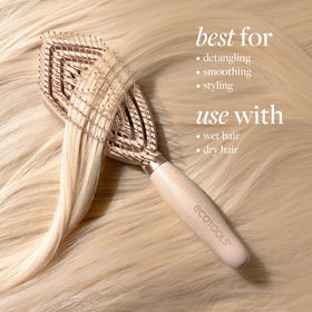 EcoTools Fine Hair Detangler brush held in hand with no-slip grip