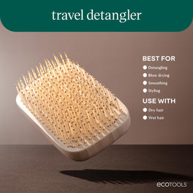 EcoTools Travel Detangler Hairbrush in a cosmetic bag