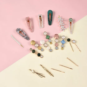 Elegant Mehayi hair accessories arranged on a flat surface
