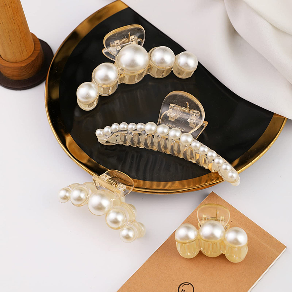 Elegant Mehayi pearl hair claw clip in a bun hairstyle