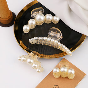 Elegant Mehayi pearl hair claw clip in a bun hairstyle