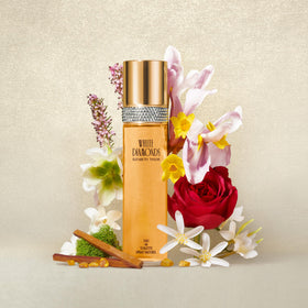 Elizabeth Taylor White Diamonds Eau de Toilette with floral background