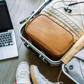 Elviros Toiletry Bag with travel essentials laid out
