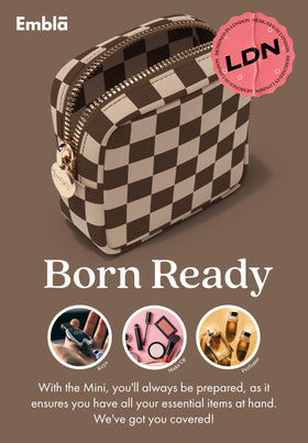 Embla Makeup Bag in use as a clutch handbag