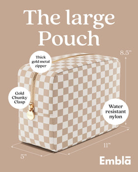 Embla Makeup Bag open displaying compartments