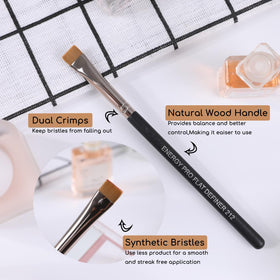 ENERGY Flat Definer Brush 212 in a makeup setup with products