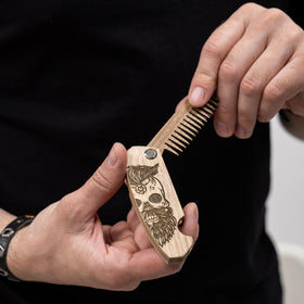 Enjoy The Wood Beard Comb close-up on walnut texture
