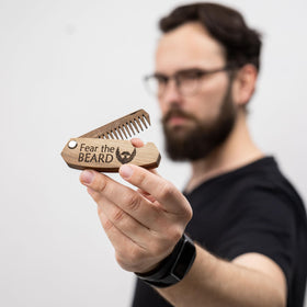 Enjoy The Wood Beard Comb displayed with pocket beard brush