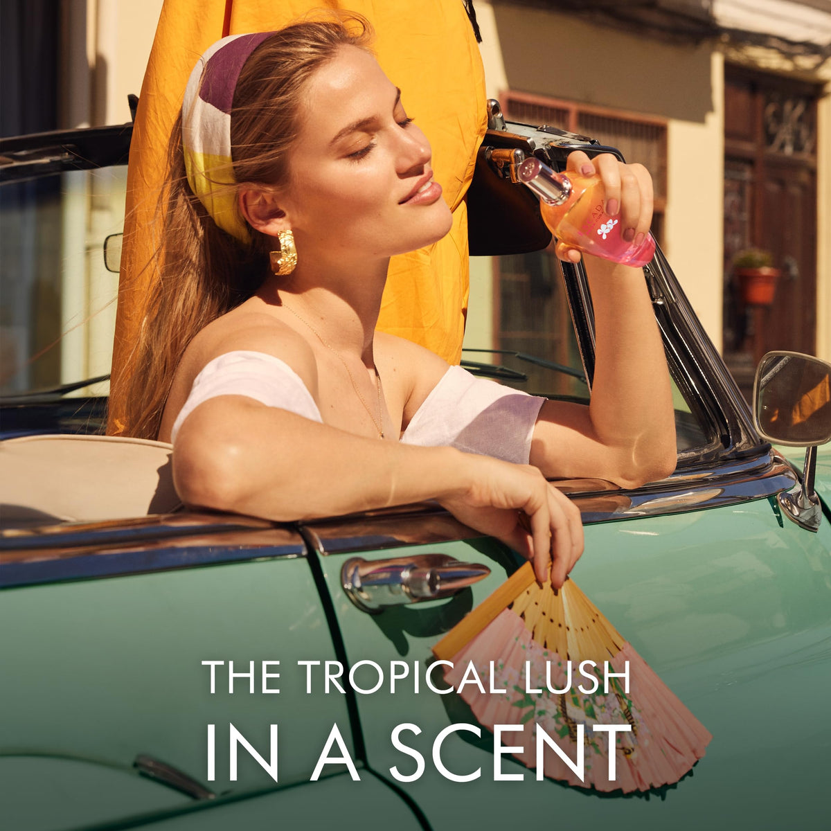 Escada Brisa Cubana fragrance bottle against a tropical backdrop