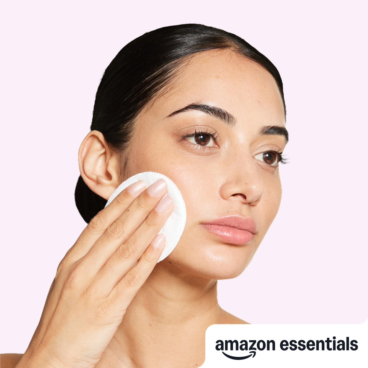 Essentials Oval Premium Cotton Pads in use for makeup removal