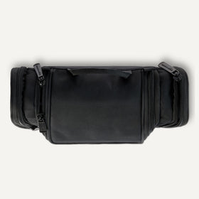 Essentials toiletry bag hanging on a towel rack